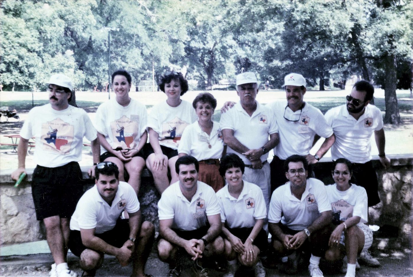 A past Vega family reunion, everyone wearing matching white t-shirts with a Texas-shaped graphic.